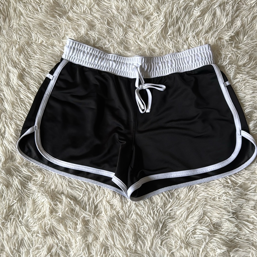 White and black running shorts
